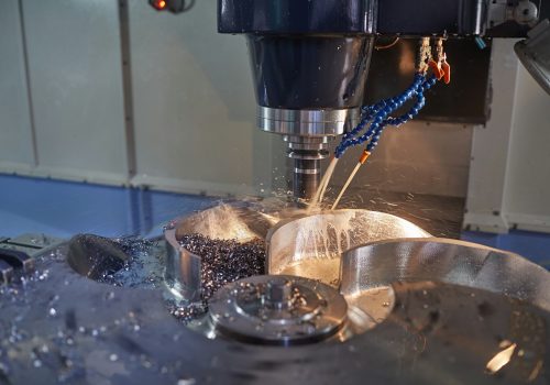 vertical milling machine close-up processes a part in production